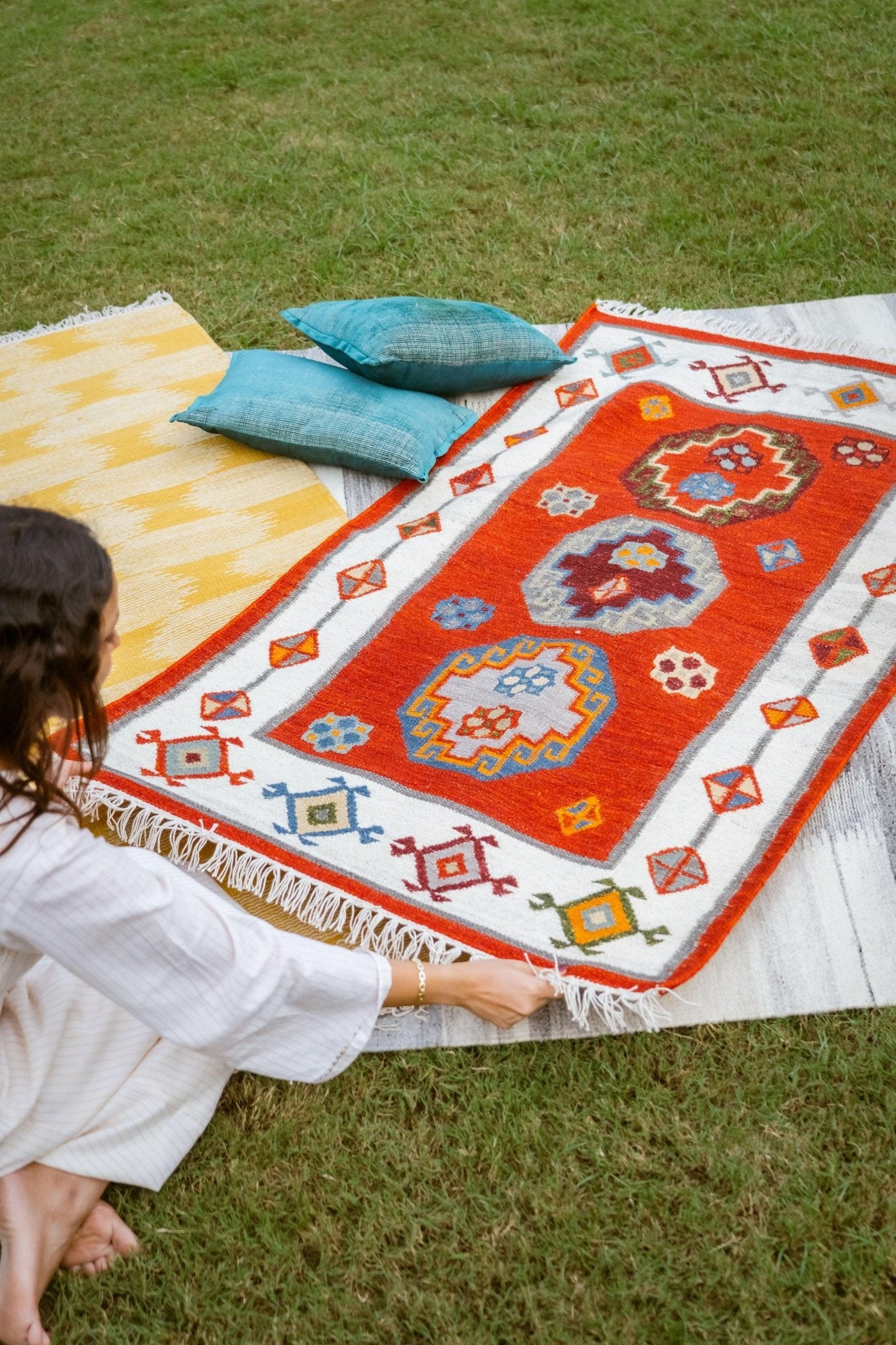 3x5 feet wool and cotton geometric rug with bold colors and white border detail