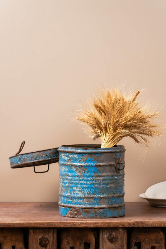 Vintage blue iron canister with weathered distressed finish, 11 inches tall, rustic farmhouse storage decor