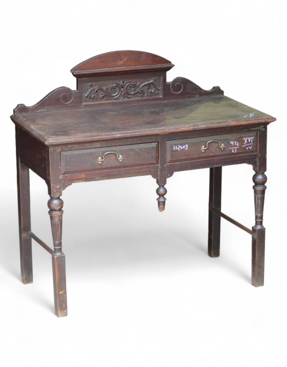 Vintage wooden desk with intricate carvings