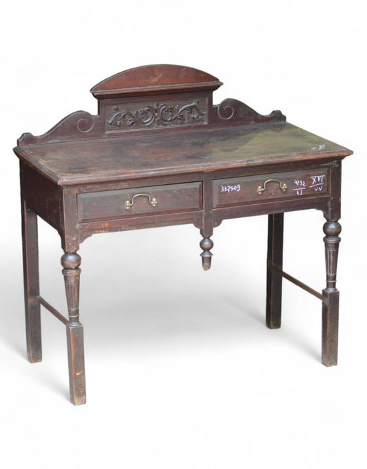 Vintage wooden desk with intricate carvings