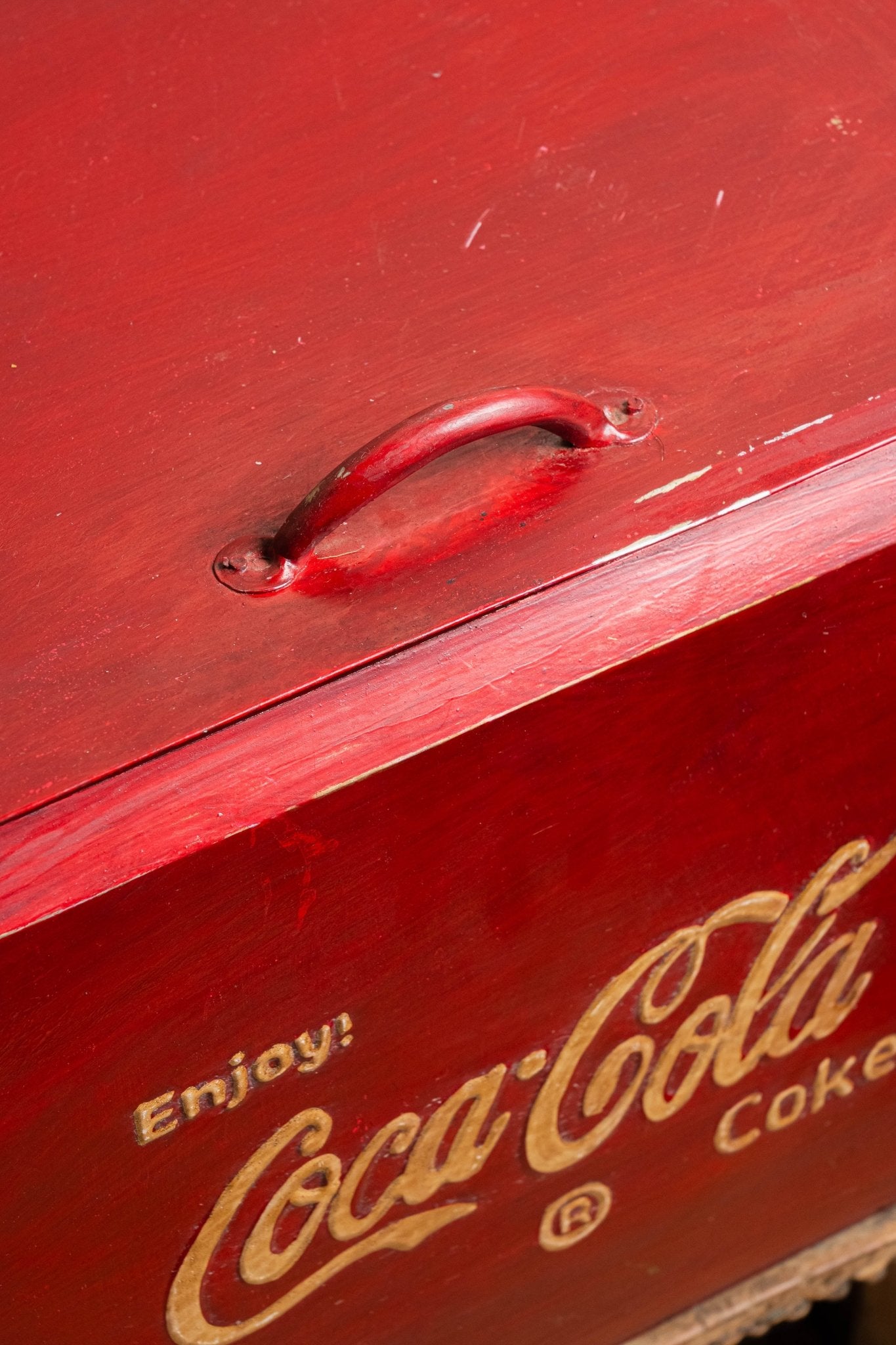 Red Coca-Cola cooler with gold lettering