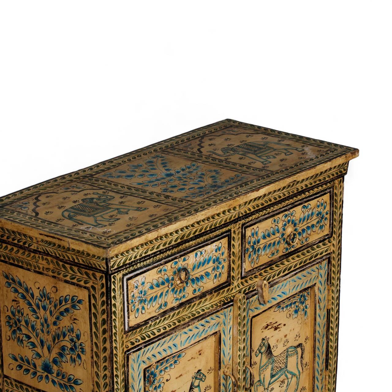 Decorative wooden chest with intricate carvings on a white background