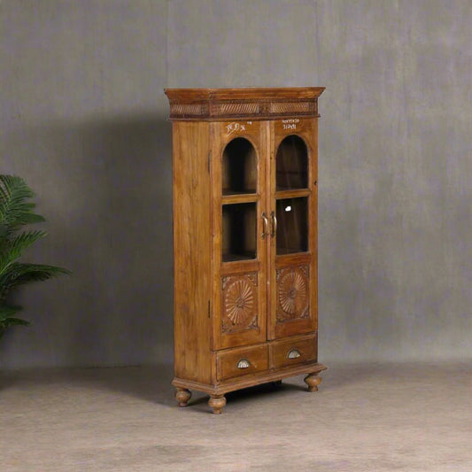 Vintage wooden glass almirah in teak wood with brass accents, floral carvings, 56 inches tall storage cabinet"