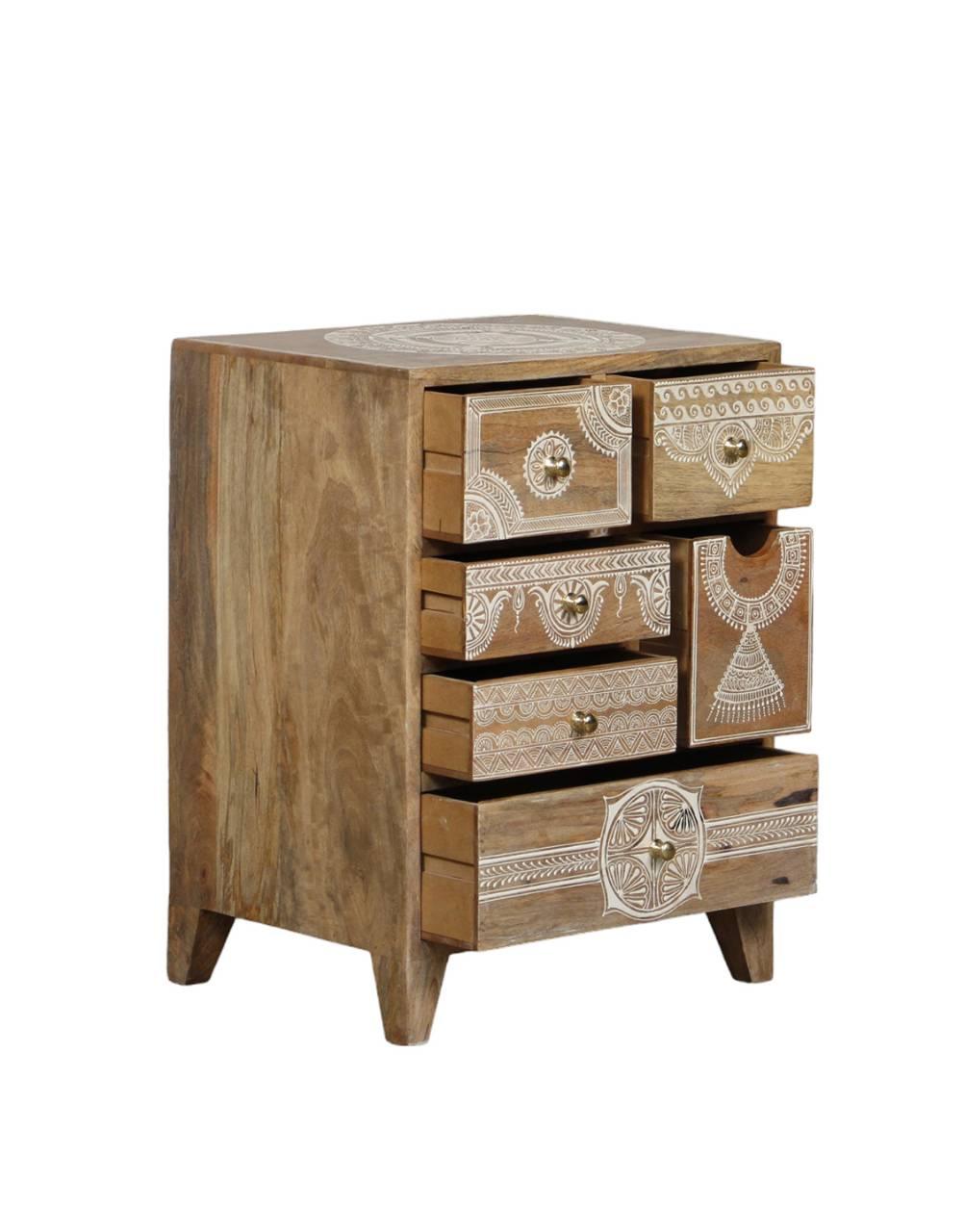Wooden dresser with decorative patterns on a white background