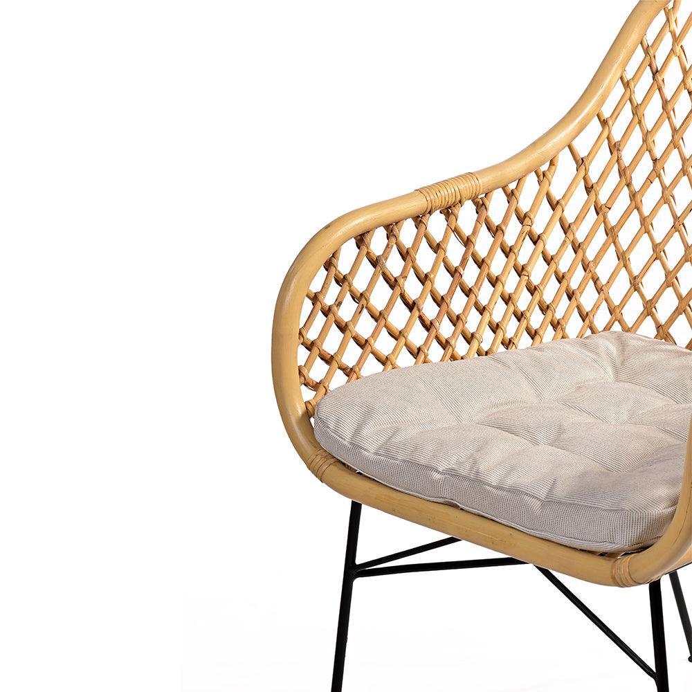 Wicker chair with a gray cushion on a white background