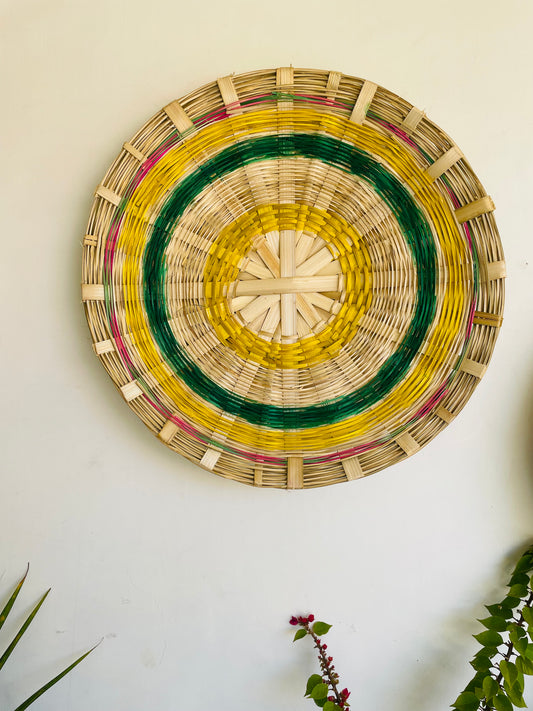 our Bamboo wall hanging is going to make for a fresh addition to the house decor. The exquisite weave design with the floral dyes adds to its vibrant aesthetic. The wall decorator is sure to bring a pop of color and enliven the room settings with the vibrant decor. The handmade basket is eco-friendly, hand-dyed with organic colors and sturdy. Make the most of sustainable home choices with this vibrant set of handcrafted multi-utility baskets. Baskets includes hooks for hanging.