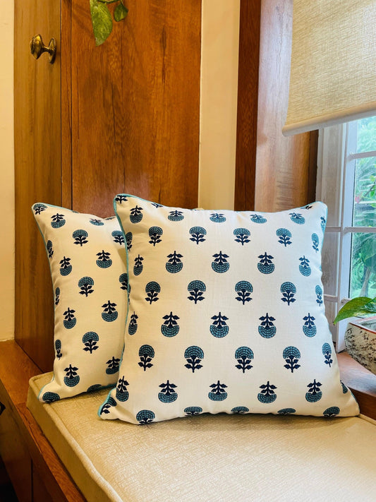 Turquoise and white block print cushion covers styled on sofa – Tesu Cushion Covers